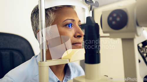 Image of Eye test, machine and a woman for an optometry problem, scanning retina or surgery at a clinic. Healthcare, ophthalmology and a patient or person with an exam for vision, glasses or lens check