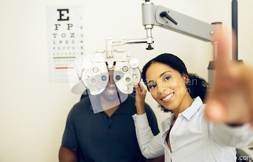 Image of Woman, optometrist or optical equipment for eye testing, optometry or doctor for exam, assessment or vision. Healthcare, man or eyesight in consult, glasses and clinic for checkup, diagnosis or job