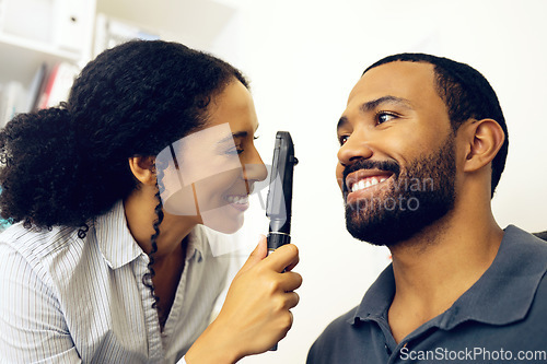 Image of Patient, eye exam and test in clinic with ophthalmoscope to check for glaucoma, ocular services or healthcare assessment. Happy optician, woman and retina analysis for eyesight of man with lens tools