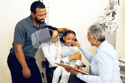 Image of Family, consulting and eye care with a woman optician in a clinic to see a patient for vision assessment. Mother, father and daughter at the optometrist for an appointment to test eyesight for kids