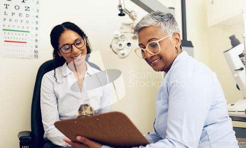 Image of Optometrist, patient and eye exam, clipboard and health insurance paperwork, help and medical with eyecare. Wellness, contract or agreement with vision, assessment and women in clinic for optometry