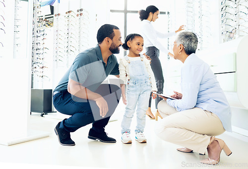 Image of Optometrist, father and child for eye care, optometry or vision assessment or test in clinic or store. Man, senior woman or girl kid at optician for eyesight appointment for focus or glasses with joy