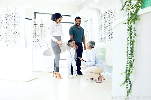 Image of Optometrist, parents or child for eye care, optometry or vision assessment or test in clinic or store. Man, senior woman or girl kid at optician for eyesight appointment for focus or glasses with joy