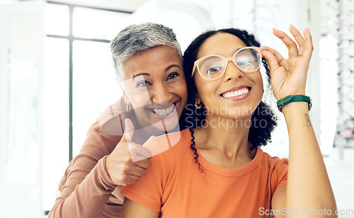 Image of Optometrist, woman and glasses with thumbs up for medical success, frame choice and happy customer service in store. Professional eye care doctor and client in portrait with like, yes and support