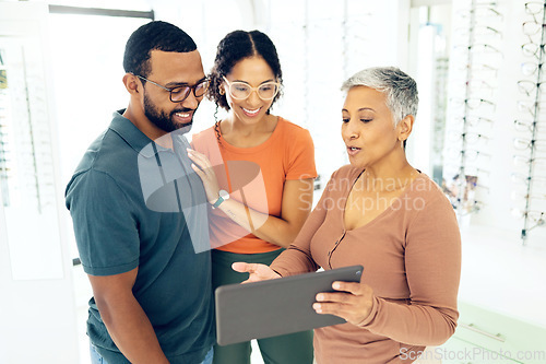 Image of Optometry, tablet and people shopping for glasses and on a website for online information. Lens, happy and a man and woman with an optometrist and technology for vision and eyewear consultation