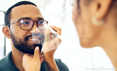 Image of Vision, glasses and eye test with a man at the optometrist for a prescription frame lens assessment. Face, smile and eyewear with a customer talking to a consultant at the optician for assistance