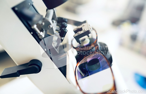 Image of Lens, glasses or tool for eye care, vision and focus with closeup at optometrist or optometry. Eyes assessment, ophthalmology and healthcare for medical support, eyewear or spectacles to see or zoom