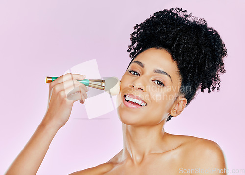 Image of Portrait, happy woman and brush for makeup in studio for mockup in beauty on pink background. African, female model and smile in confidence for powder, foundation or cosmetic for results in coverage