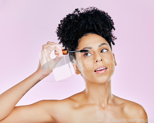 Image of Mascara, brush and makeup, woman and beauty with skin, cosmetic tools for lashes and shine isolated on pink background. Eyelash growth, product and cosmetology with transformation in a studio