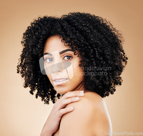 Image of Woman, face and beauty, hair and natural curls, salon treatment and shine, healthy skin glow on studio background. Skincare, dermatology and clean makeup, haircare and texture with afro in portrait