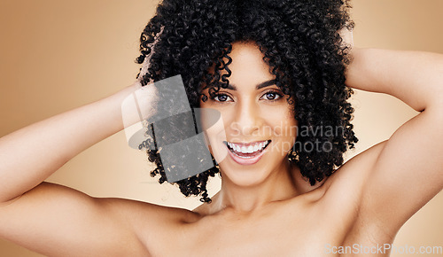 Image of Woman, portrait and hair, curly and natural beauty, smile for salon treatment and texture on studio brown background. Face, skin and glow with growth, haircare and cosmetology with model and volume