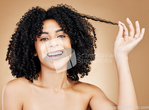 Image of Curly, hair strand and portrait of woman in studio for natural beauty, healthy growth and coil textures on brown background. Happy model pull afro hairstyle for salon aesthetic, keratin and treatment