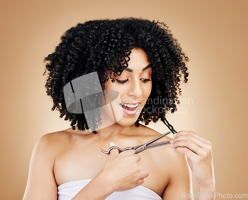 Image of Woman, hair and cut for change, transformation and style with happiness, smile or brown studio background. Scissors, self care or freedom from loss, beauty and hairdresser for curls, positive or face