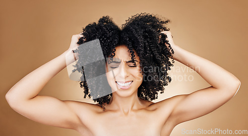 Image of Woman afro, studio hair problem and grooming care mistake, shampoo allergic reaction or texture crisis, risk or fail. Spa salon hairstyle, keratin and face of person stress on brown background