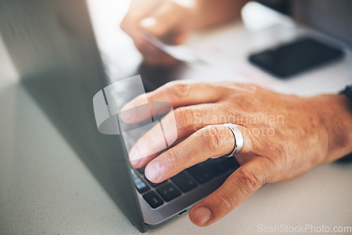 Image of Hand, laptop and online shopping closeup with a person in their home for ecommerce payment or retail. Bank, finance or accounting with an adult planning for retirement on the internet as a pensioner