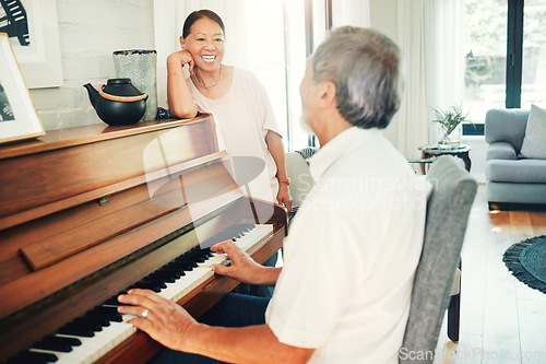 Image of Happy woman, piano or senior man playing a song or music for wife in living room with bonding or entertainment. Smile, keyboard or mature Asian couple in retirement enjoy instrument at modern home
