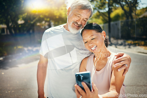 Image of Couple, smile and break from run for social media, meme and funny joke in street, humor and comedy. Happy senior people, retirement and fitness for health, laughing and earphones for smartphone