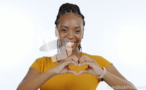 Image of Woman, portrait and hands with heart emoji for love, support and happiness on white background in studio. Black person, smile and hand gesture for care or kindness, trust and motivation in closeup