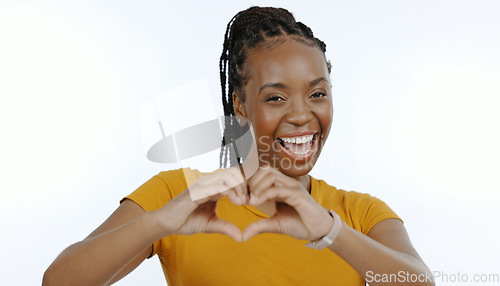 Image of Woman, studio portrait and hands with heart emoji for love, support and positive sign by white background in close up. Black person, smile and hand gesture for care with kindness, trust and hope