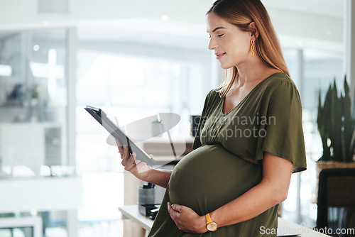 Image of Tablet, smile and pregnant business woman in office reading research information on internet. Maternity, happy and female designer from Canada with pregnancy work on digital technology in workplace.