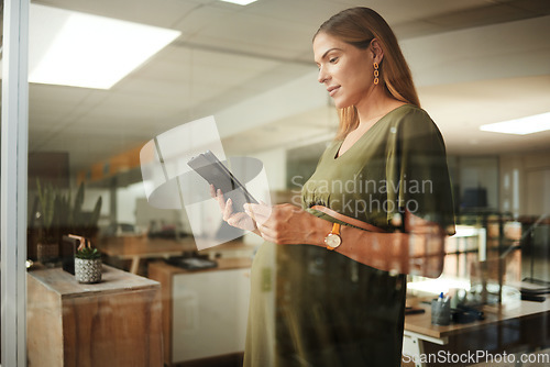 Image of Pregnant woman, reading and tablet in office for business, networking or ideas for marketing. Person, touchscreen and thinking at work for communication, research or internet chat at company