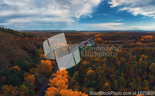 Image of Aerial view of road in beautiful autumn Altai forest