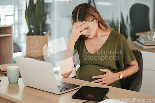 Image of Woman, office and pregnant with stress, headache and laptop at work, burnout and workplace. Maternity, employee and pregnancy with hand on stomach, pain and tired for baby, working and healthcare
