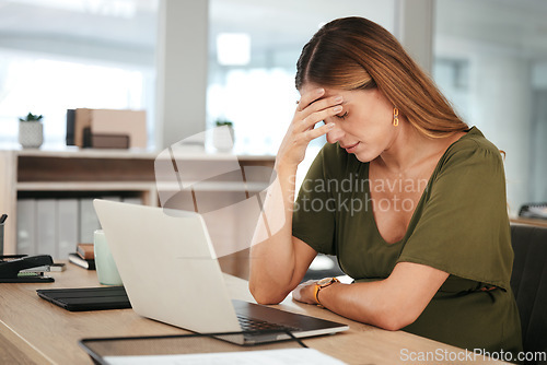 Image of Business, woman and headache in office with tired, burnout and relax with eyes closed at desk or table. Person, professional and employee with hand on face for anxiety or stress at corporate company