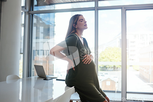 Image of Pregnant, woman or back pain in office with stress, burnout and relax with eyes closed at desk or table. Person, pregnancy or hand on stomach for risk, anxiety or tired at professional company or job