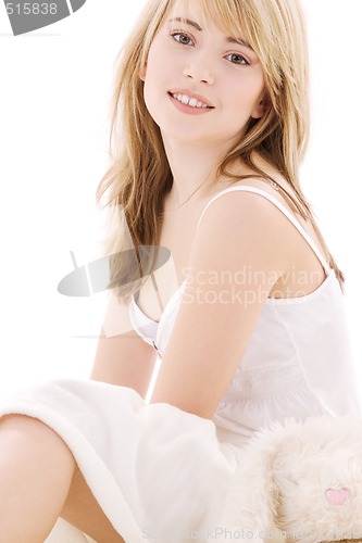 Image of happy teenage girl in bed