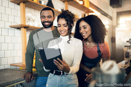 Image of Barista group, coffee shop and together with smile, tablet and planning menu at small business, startup or partnership. Man, women and digital touchscreen in restaurant, cafe and happy with teamwork