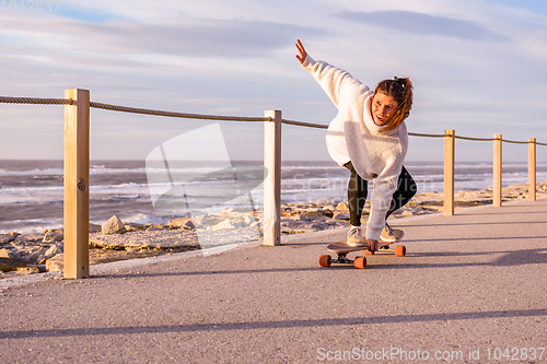 Image of Girl riding a skateboard 