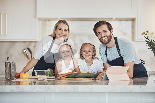 Image of Smile, portrait and family cooking in kitchen together for bonding and preparing dinner, lunch or supper. Happy, love and girl children with vegetables or ingredients with parents for meal at home.