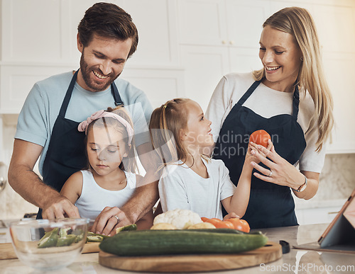 Image of Happy family, together and bond in kitchen by cooking with preparation, vegan diet and dinner. Children, parents and helping with meal, quality time and nutrition with smile learning and teaching