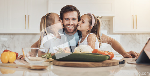 Image of Portrait, family and kiss on the cheek from kids with their father in the kitchen of a home for cooking together. Face, smile and girl children with their happy parent in the house to make a meal