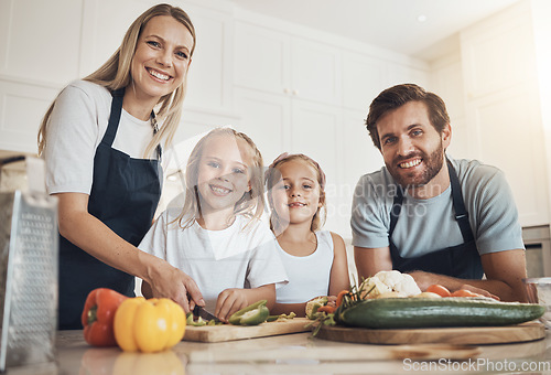 Image of Family portrait, smile and cooking in kitchen with vegetables for lunch, diet and nutrition. Happy parents and children, food and ingredients for meal prep, healthy and teaching the kids at home