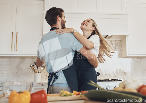 Image of Cooking, dancing or happy couple in celebration with food for a healthy vegan diet together at home. Hug, vegetables or excited woman bonding in kitchen for dinner with love, smile or romantic man