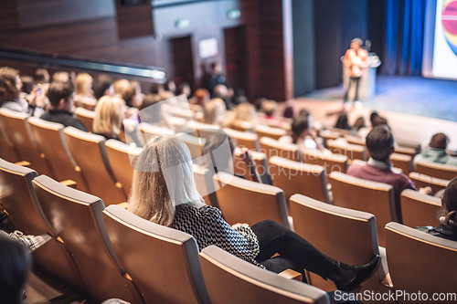 Image of Woman giving presentation on business conference event.