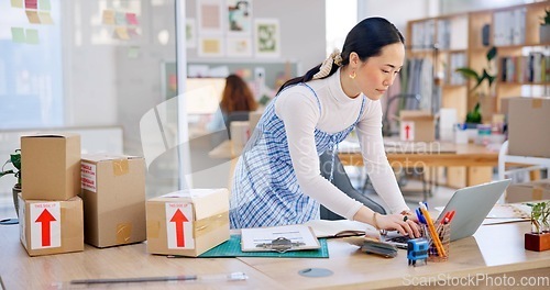 Image of Ecommerce, Asian woman with checklist and boxes at laptop, reading sales or inventory at fashion startup. Online shopping, delivery and small business owner, stock list for web shop package checking.