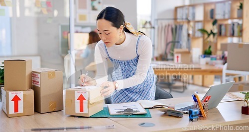 Image of Ecommerce, Asian woman with checklist and boxes at laptop, reading sales or inventory at fashion startup. Online shopping, delivery and small business owner, stock list for web shop package checking.