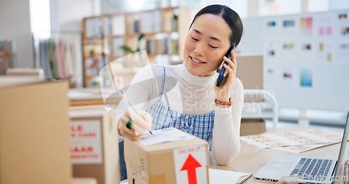 Image of Ecommerce, woman with phone call and boxes, writing and checking sales and work at Japanese fashion startup. Online shopping, package and small business owner with smartphone, orders and networking.