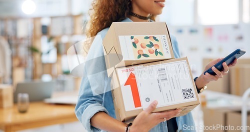 Image of Package, startup and closeup of woman with phone for business at a fashion retail boutique. Networking, technology and female entrepreneur with cardboard boxes and cellphone for delivery information.