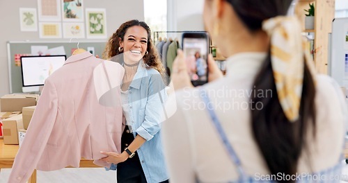 Image of Fashion influencer, cellphone and women live streaming clothes presentation, style review or mobile app broadcast. Phone, content creator team and small business owner teamwork on retail commercial