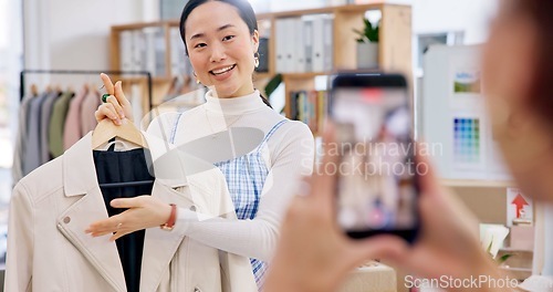 Image of Fashion influencer, phone and Asian woman live streaming clothes, leather jacket design or shooting vlog commercial. Cellphone recording, social media app and Japanese person explain retail product