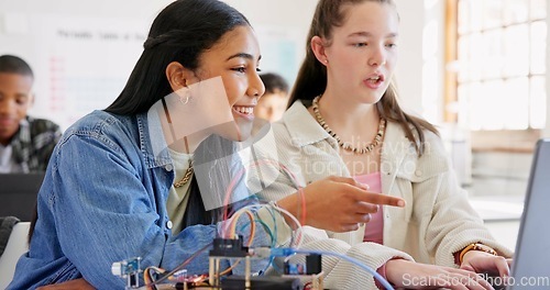 Image of Robotics, children and education with laptop at school learning coding, robot or programming. Girl students in classroom for technology, electronics or science for development, innovation or teamwork