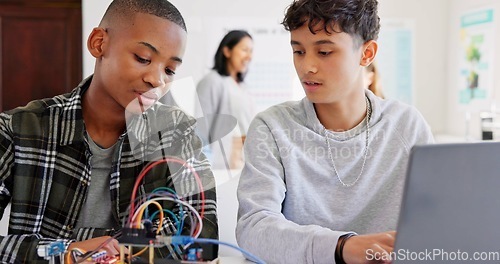 Image of Robotics, education and students with laptop at school learning coding, future or programming. Teenager children in class for technology, electronics or science as development, innovation or teamwork