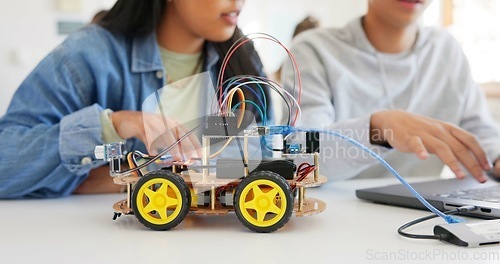 Image of Robotics, education and hands of children at school learning about coding, robot or car toy in class. Kids in classroom for technology, electronics or science for development, innovation and teamwork