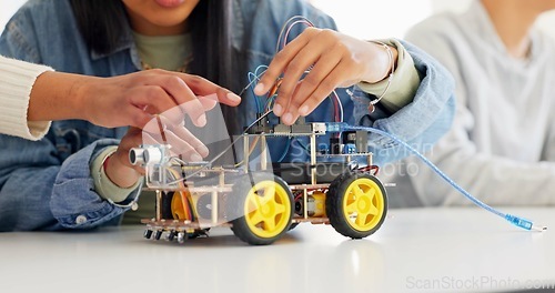 Image of Technology, closeup and car robotics of students in classroom, education or learning electronics with cables and wire for innovation. School kids, learners and knowledge in science class for research