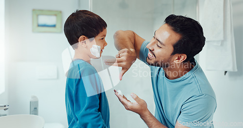 Image of Shaving, bathroom and father teaching child about grooming, hygiene and facial routine. Happy, help and a young dad showing a boy kid cream or soap for hair removal together in a house in the morning