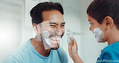 Image of Shaving, bathroom and father teaching child about grooming, playing hygiene and facial routine. Playful, help and dad showing boy kid cream or soap for hair removal together in a house in the morning